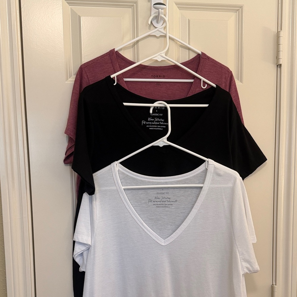 Torrid. Classic Fit V Neck Tee’s. Very soft fabric in Black, White, Rose. NWOT